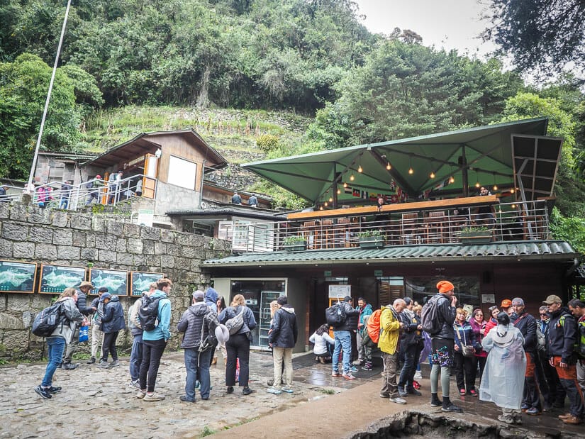 A crowd of visitors in front of the Main Entrance at Machu Picchu