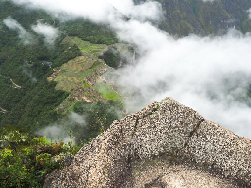 Machu Picchu viewed from a rocky summit of Huayna Picchu
