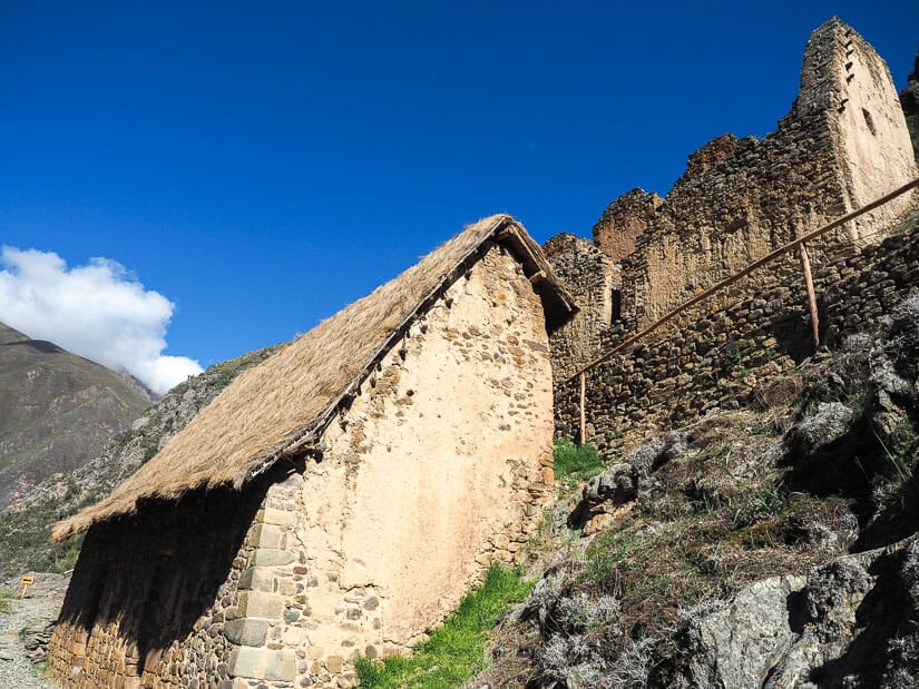 Looking up at two Inca storehouses