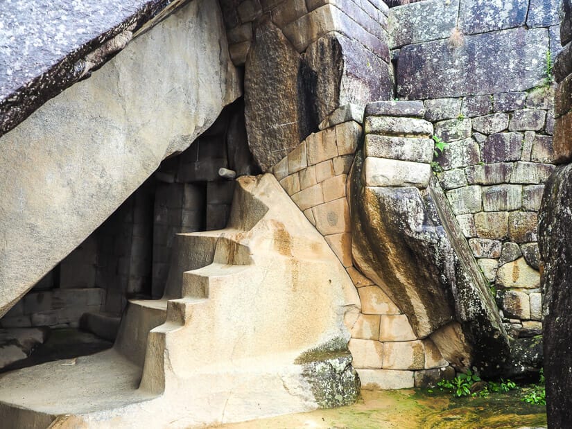 Carved stairs and walls in a cave below the Sun Temple at Machu Picchu