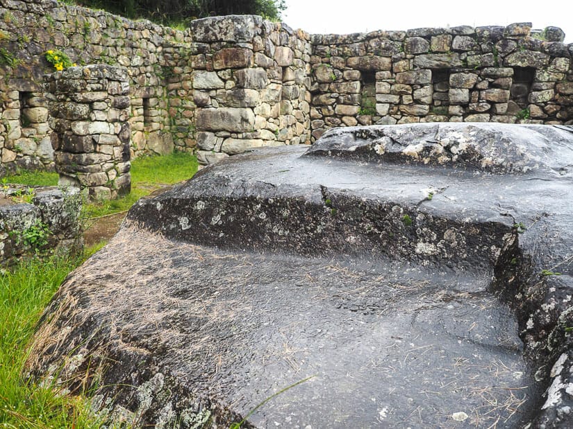 An altar and Inca stone walls on the trail between Sun Gate and MP