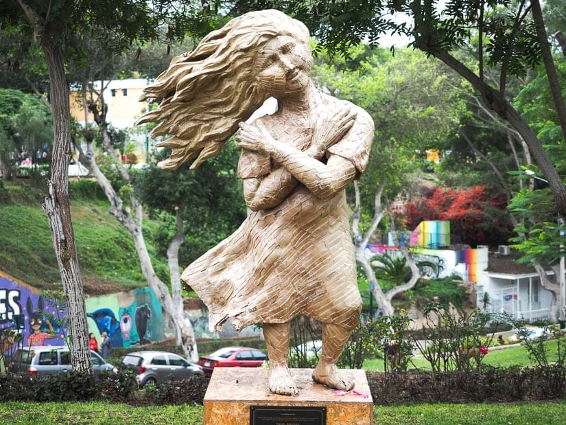 A statue of a girl with her hair blowing sideways