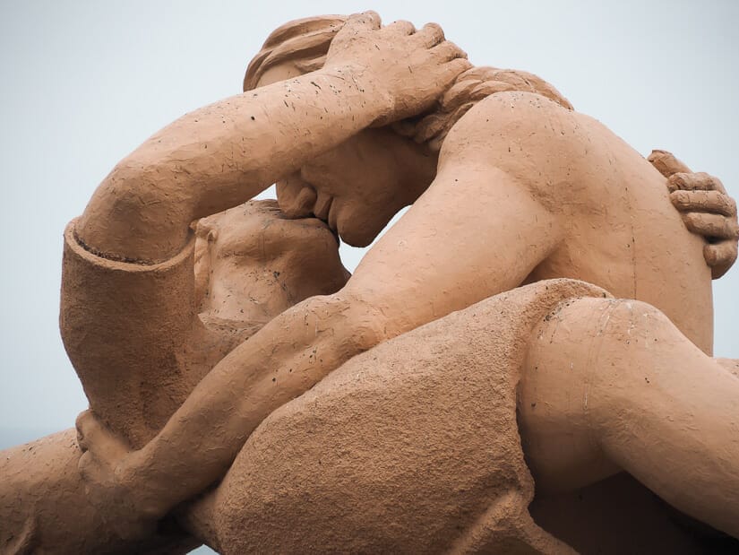 Close up of a statue of a man and woman embracing