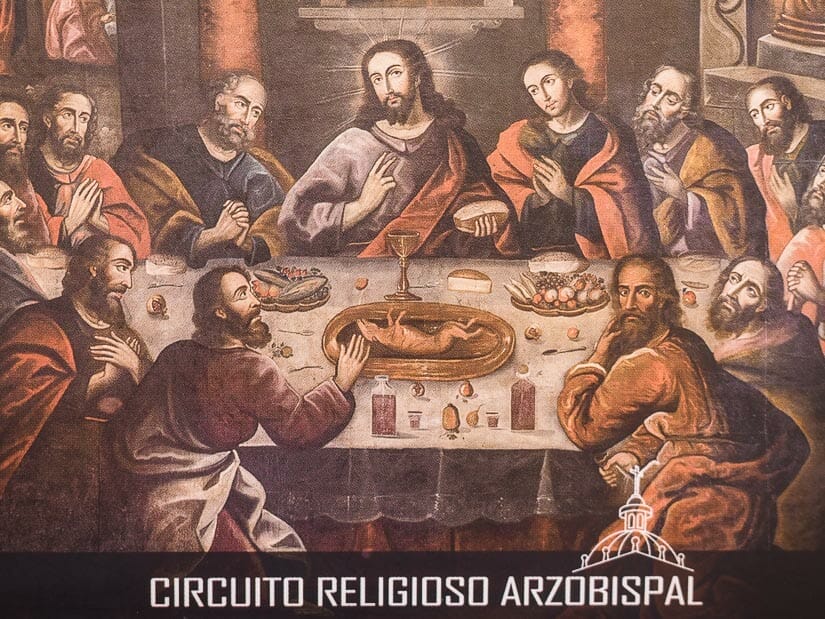 A postcard of a famous painting in the Cusco Cathedral showing Jesus and the Disciples about the eat guinea pig at the last supper