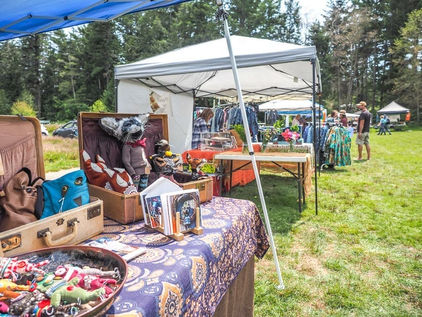 Some vendor tables with clothing and other items on them