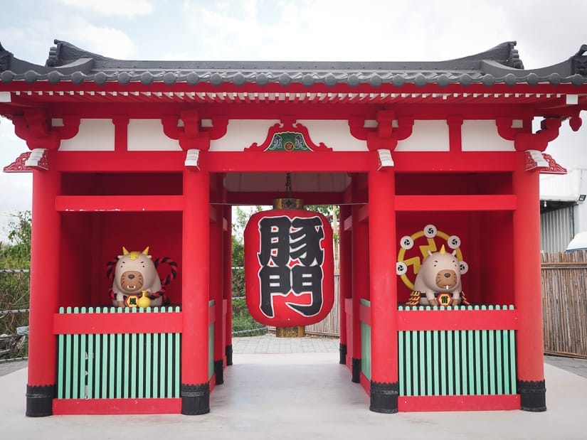 A red Japanese style shrine but instead of gods it has statues of capybaras