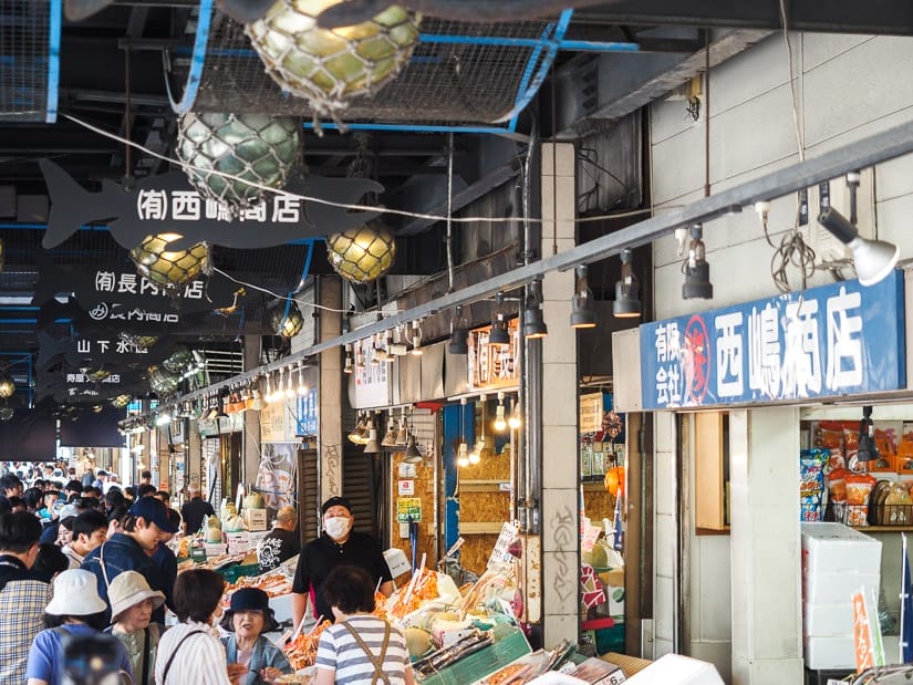 Looking up a busy seafood market street