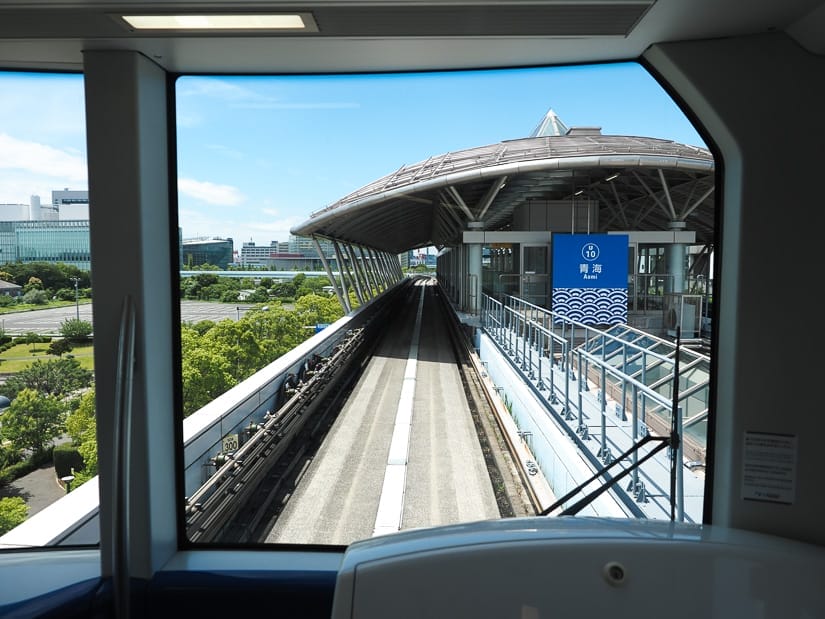 Looking out the front of a driverless skytrain as it pulls into a station