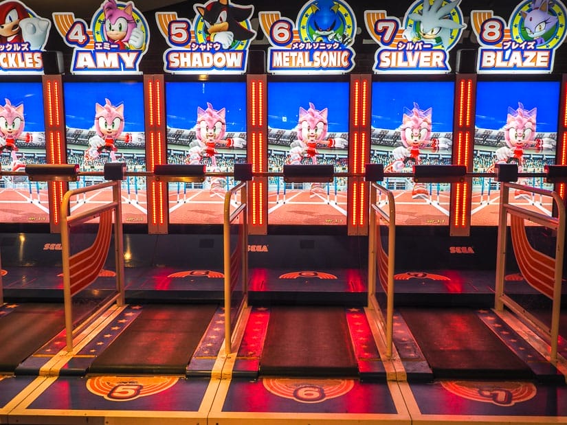 A row of video game arcade stalls for running on with Sonic the Hedgehog on the screen in front of each one