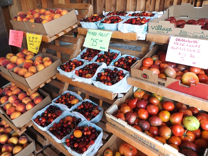 Several boxes of fresh fruits on display in a produce market