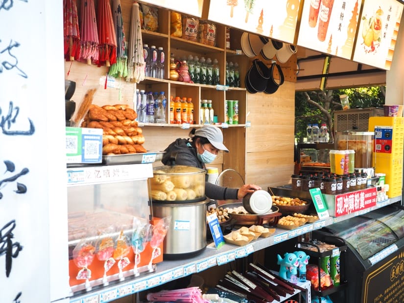 A food vendor at West Lake, with lots of different foods and drinks on display