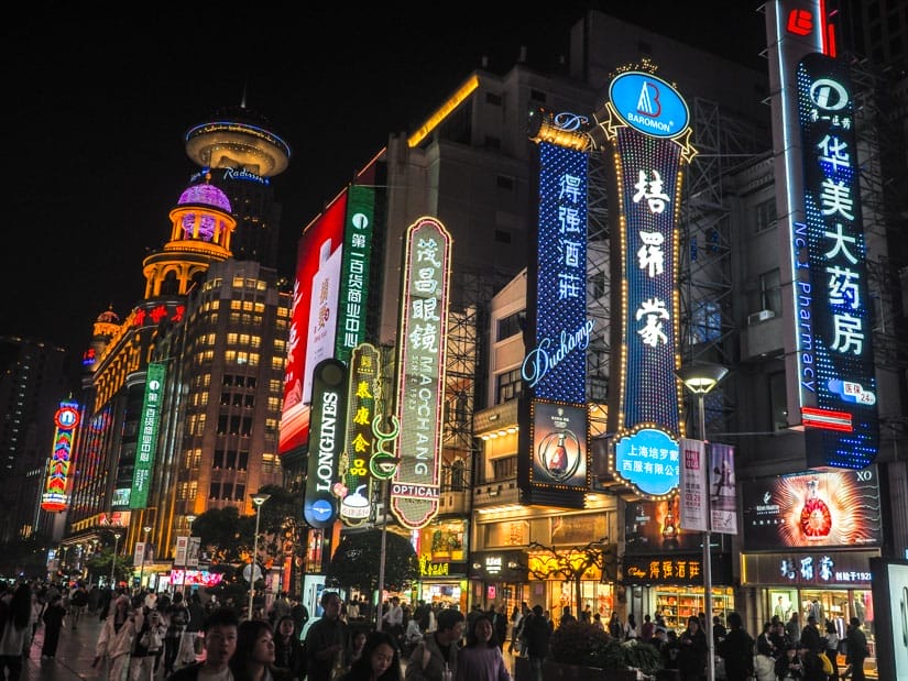 Looking down a strip of shops in Shanghai at night