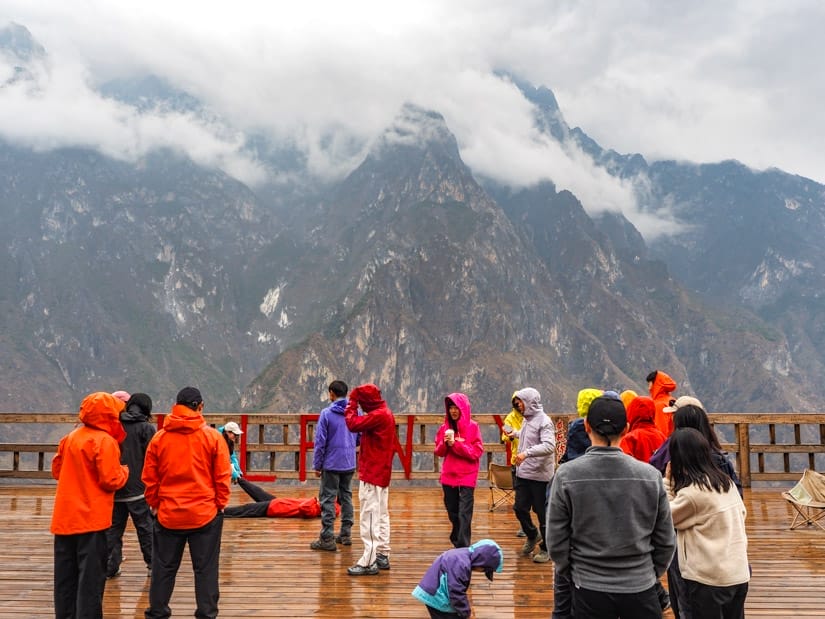 Several Chinese trekkers on the rooftop lookout platform at Halfway Guesthouse