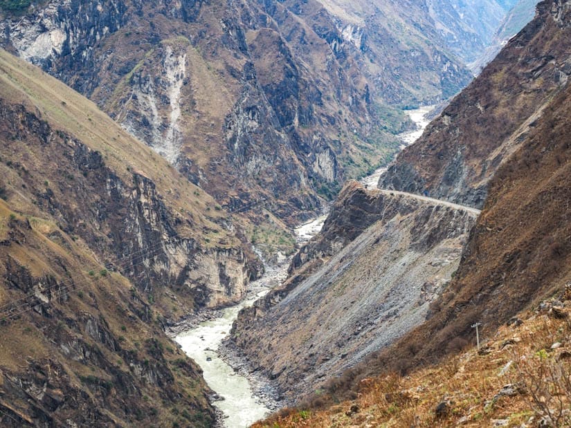 Looking up Tiger Leaping Gorge with vehicle road on the right